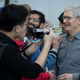 Apple CEO Tim Cook greets customers as they wait in line to purchase the new iPhone 11 at Apple’s flagship 5th Avenue store on September 20, 2019 in New York City.
